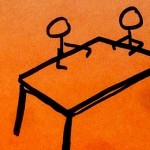 People sitting at right angles at a table